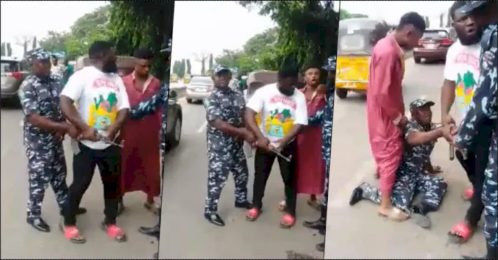 Man drags police officer's firearm as he demands for his seized phone (Video)