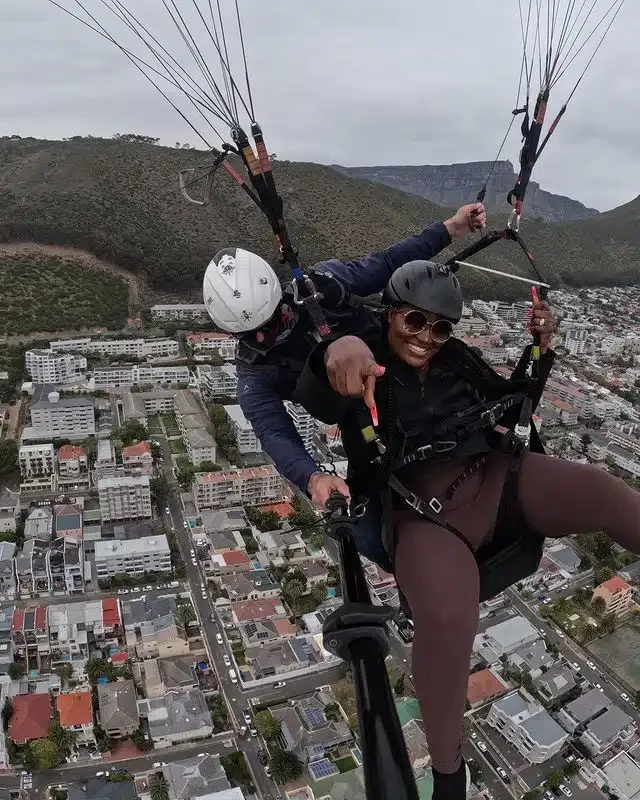 'My husband can never but I get coconut head' - Chizzy Alichi brags as she goes skydiving in Capetown (Photos)