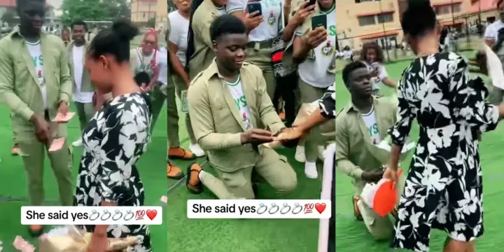 Congratulations pour in as corps member proposes to girlfriend, sprays money during passing out parade
