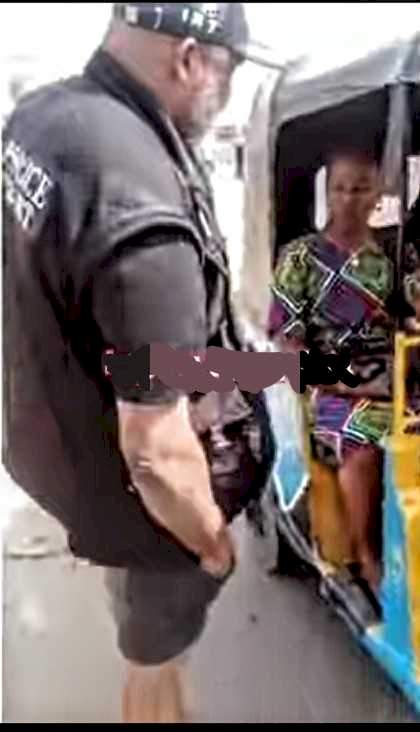 "Second time in a week"- Reactions as police officer gifts bags of rice to residents for Christmas (Video)