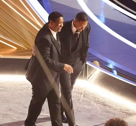 Denzel Washington, Tyler Perry, and Bradley Cooper comfort Will Smith after he slapped Chris Rock at the Oscars