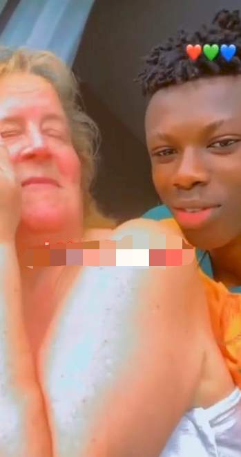 Young man and older white girlfriend spark reactions as they leave many jealous in loved-up video (Video)