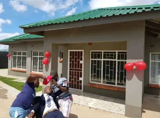 Man faints in shock as wife surprises him with completed house she secretly built