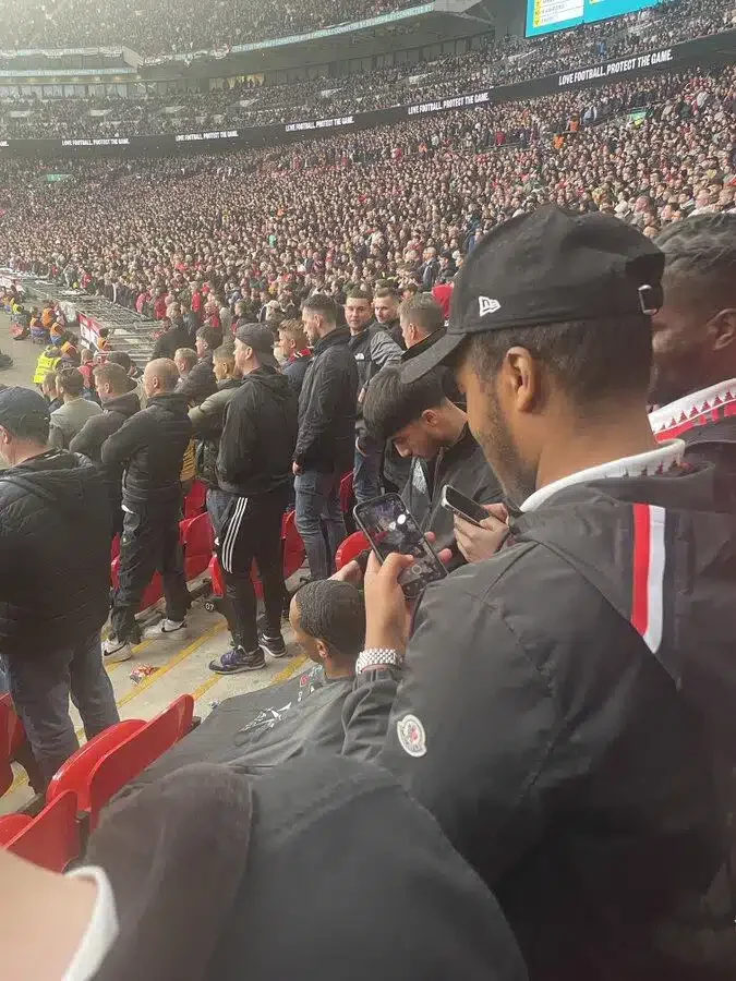 Fan spotted getting haircut inside Wembley during Manchester United vs Brighton match