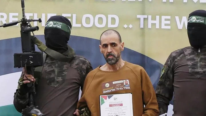 Israeli hostages Or Levy, Eli Sharabi, and Ohad Ben Ami being handed over to the International Committee of the Red Cross