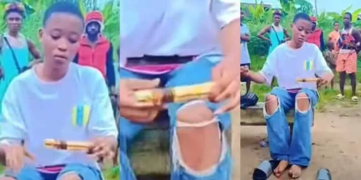 Nigerian lady caught on video using native charms to tie down her boyfriend, Wisdom, then forced to untie him