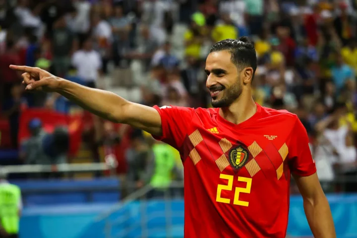 Nacer Chadli celebrates after Belgium's win over Brazil at the 2018 World Cup.