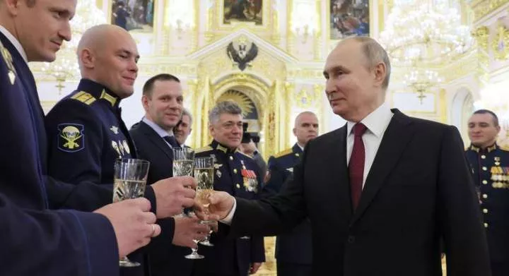Russian President Vladimir Putin toasts with Russian soldiers after awarding them with the Gold Star medal on the eve of the Heroes of the Fatherland Day at the Kremlin in Moscow on December 8, 2022.Mikhail Metzel/Getty Images