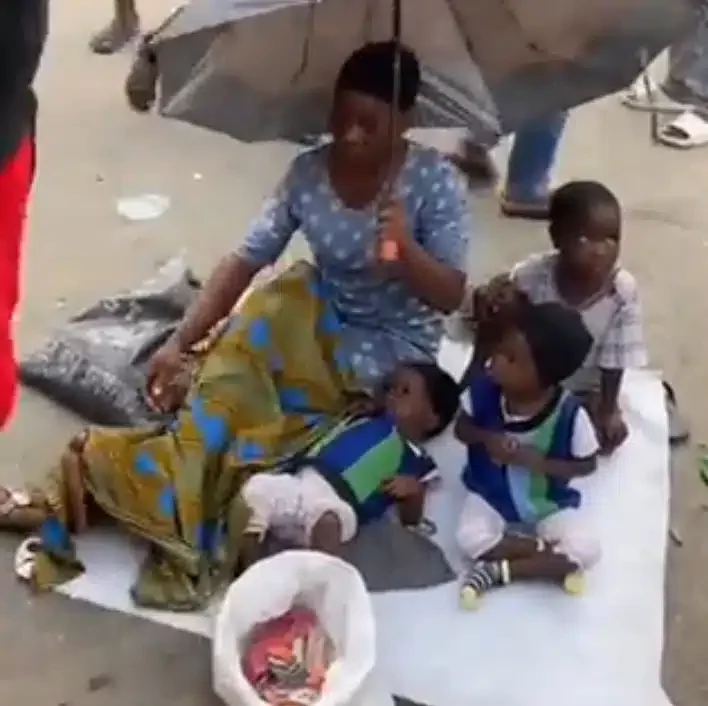 Angry lady embarrasses woman who prefers to sit and beg for money with her three little children instead of hustling (Video)