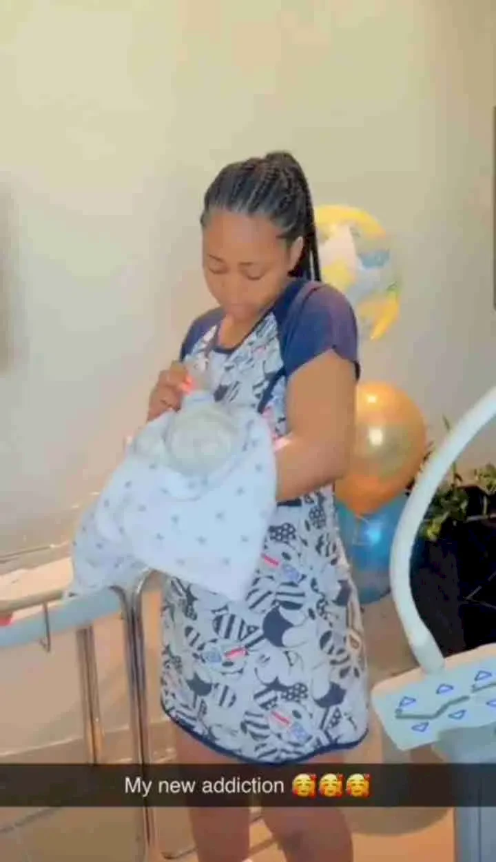 Heartwarming video of Regina Daniels cradling newborn son