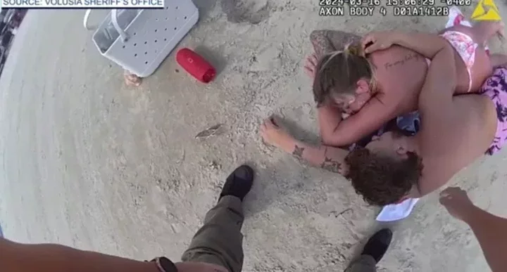 Couple arrested on Florida vacation after passing out on beach and losing track of their children