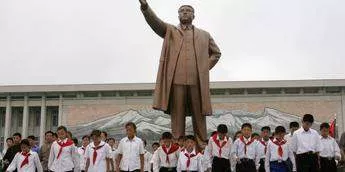 North Korean children wearing the uniform of a communist youth organisation walk away after paying their respects at the statue of Kim Il-Sung in Pyongyang.Reinhard Krause/Reuters