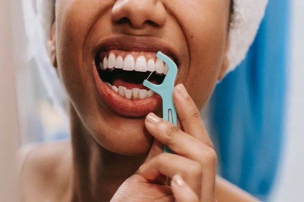 Flossing gets rid of food and plaque between your teeth