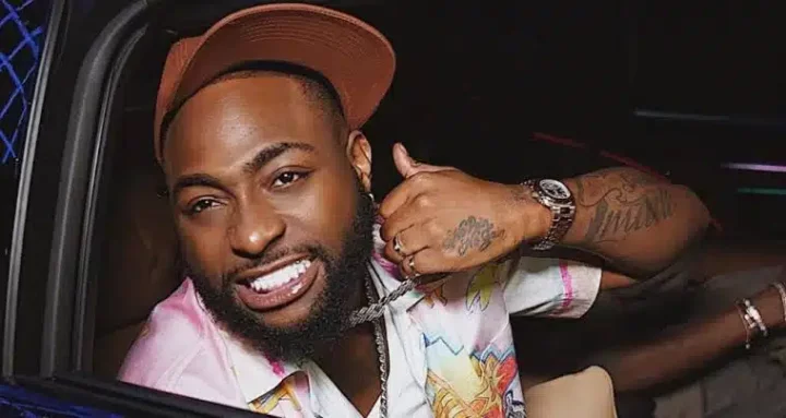 'OO1 forever, my number 1' - Fans go gaga as Davido plays chef for crew members after successful Christmas show