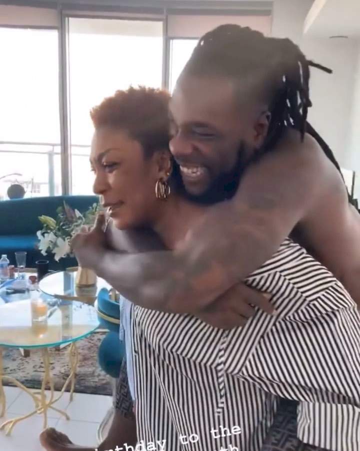 'You've lost weight' - Burna Boy's mother says as she carries Odugwu on her back on his 30th birthday (Video)