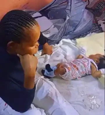'I feel your pain' - Nigerian mother cries as baby rejects small bed, sleeps on big mattress