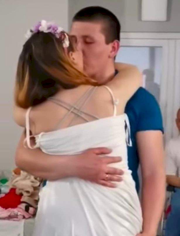 Ukrainian nurse who lost her legs when she stepped on Russian mine ties knot with husband in hospital (video)