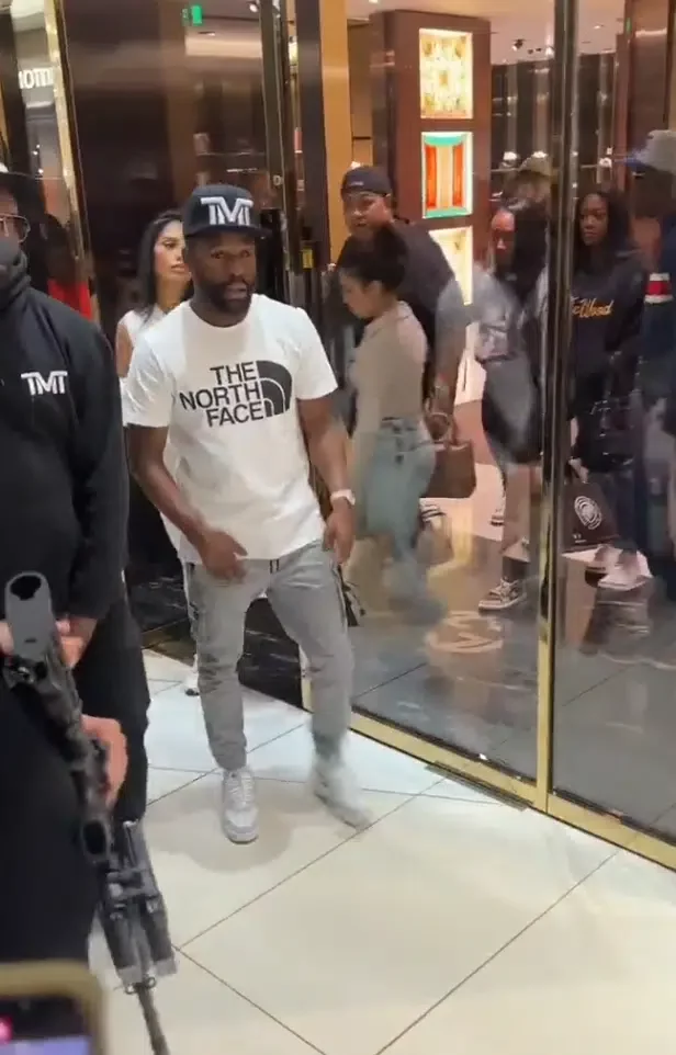 Floyd Mayweather walked out of the gucci store in South Africa