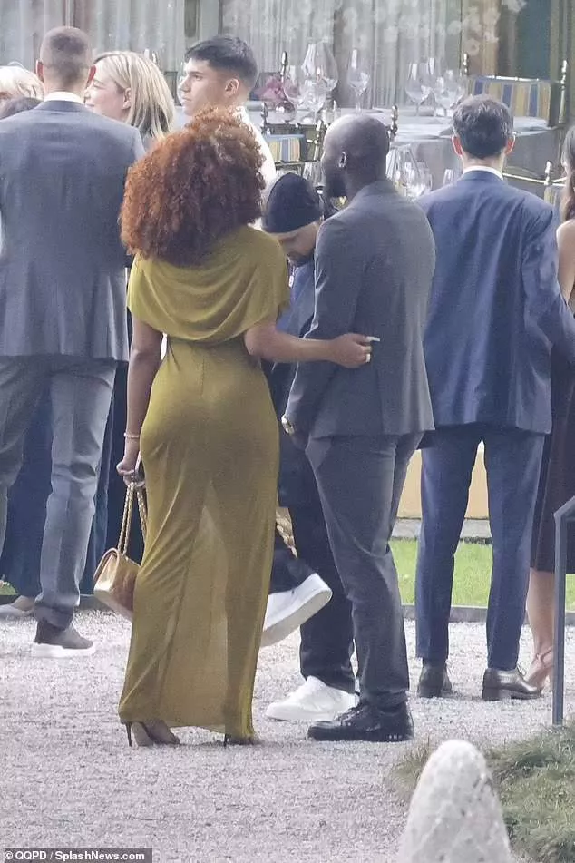 See more photos of Rapper Megan Thee Stallion and football star Romelu Lukaku holding hands at his teammate