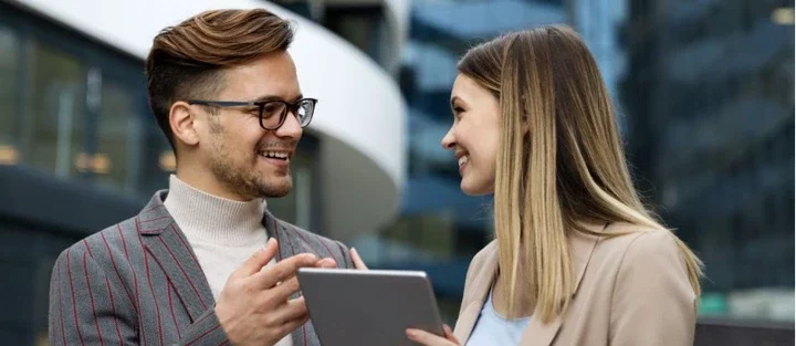 Two business people talking to each other