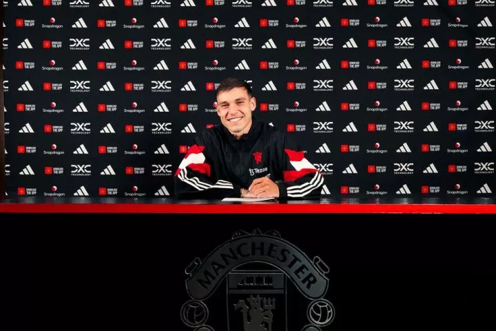 Manuel Ugarte of Manchester United poses after signing for the club at Carrington Training Ground. (Photo by Manchester United/Manchester United via Getty Images)