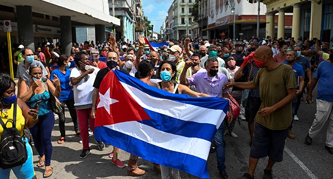 People take part in a demonstration to support the government of the Cuban President Miguel Diaz-Canel in Havana, on July 11, 2021. YAMIL LAGE / AFP