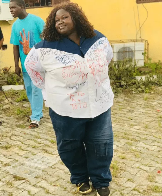 Photos of plus-sized female graduate goes viral as she signs out in grand style