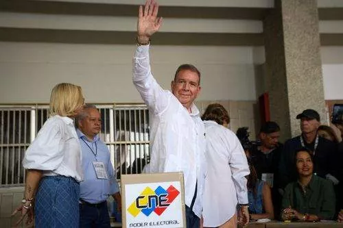 Edmundo Gonzalez, the candidate for the Democratic Unity Roundtable, gestures after casting his ballot at a polling station during the presidential election in Caracas, Venezuela, July 28, 2024. Venezuelans went to polling stations across the country and cast ballots on Sunday in the presidential election. (Photo by Str/Xinhua via Getty Images)