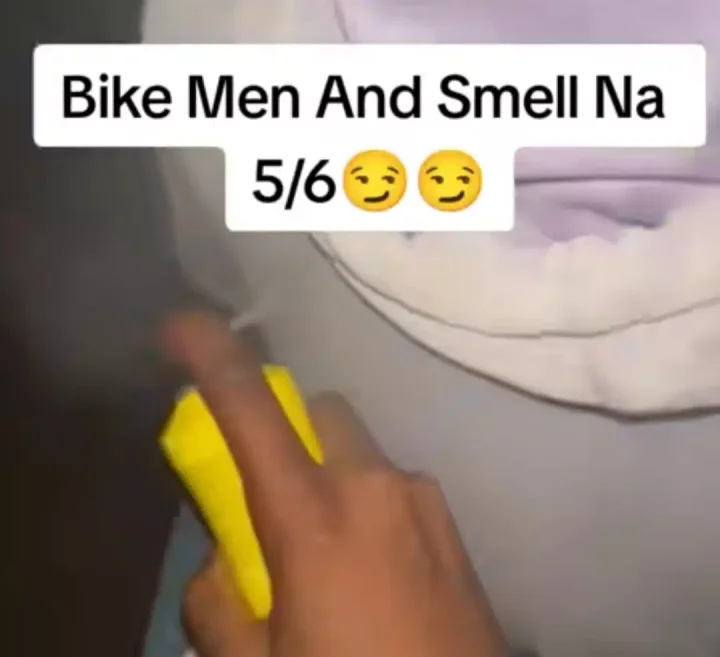 'The next customer go enjoy' - Nigerian man stuns many as he uses perfume on bike rider to solve bad odor problems