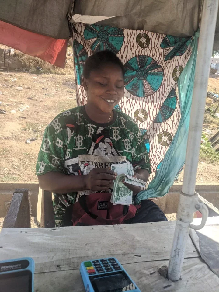 A PoS merchant at his business outlet in Kubwa-FCT