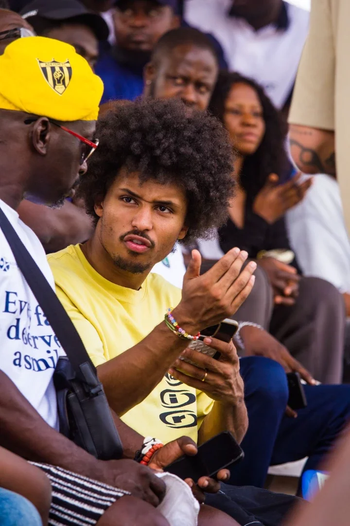 Fans react after spotting German attacker, Karim Adeyemi and his father in a stadium in Ibadan.