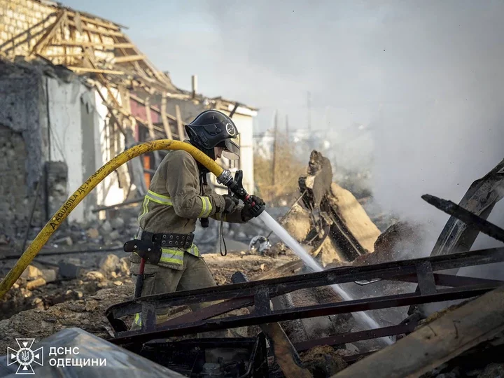 Ukrainian rescuers working at the site of an air strike in Odesa, southwestern Ukraine