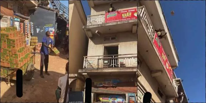 Man loads packs of goods to two-story building by flinging into the air