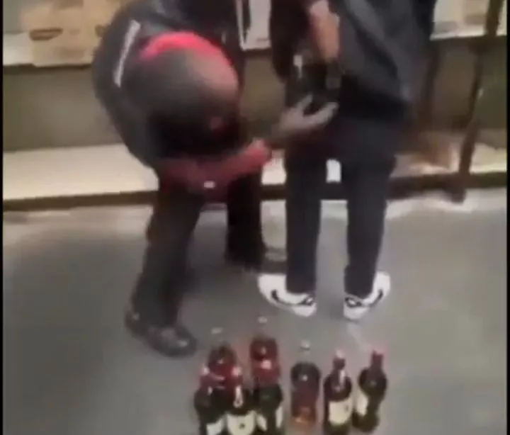 Couple caught on camera stealing drinks worth ₦5 million by hiding them in their clothes