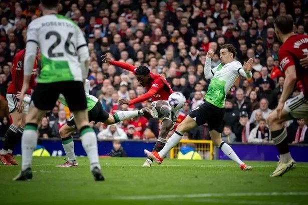 MANCHESTER, ENGLAND - APRIL 07: Kobbie Mainoo of Manchester United scores their second goal during the Premier League match between Manchester United and Liverpool FC at Old Trafford on April 07, 2024 in Manchester, England. (Photo by Ash Donelon/Manchester United via Getty Images)