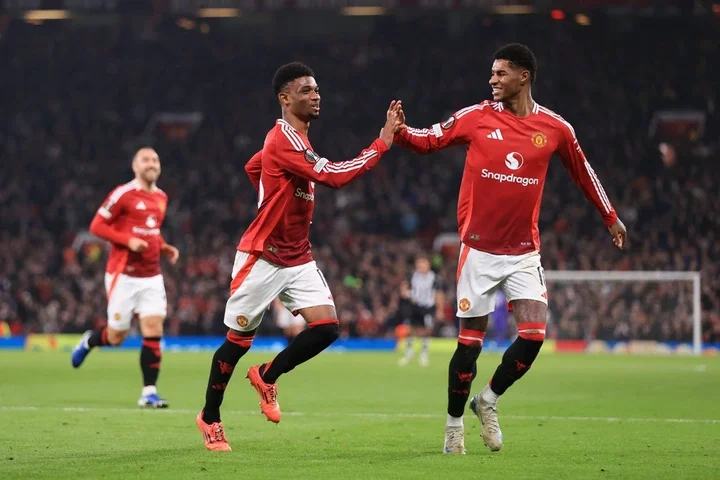 Amad Diallo of Manchester United (C) celebrates with Marcus Rashford of Manchester United after scoring their 2nd goal during the UEFA Europa Leagu...