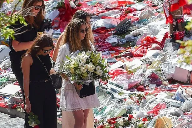 Diogo Jota's wife visits Anfield to see floral tributes as Liverpool stars pay respects