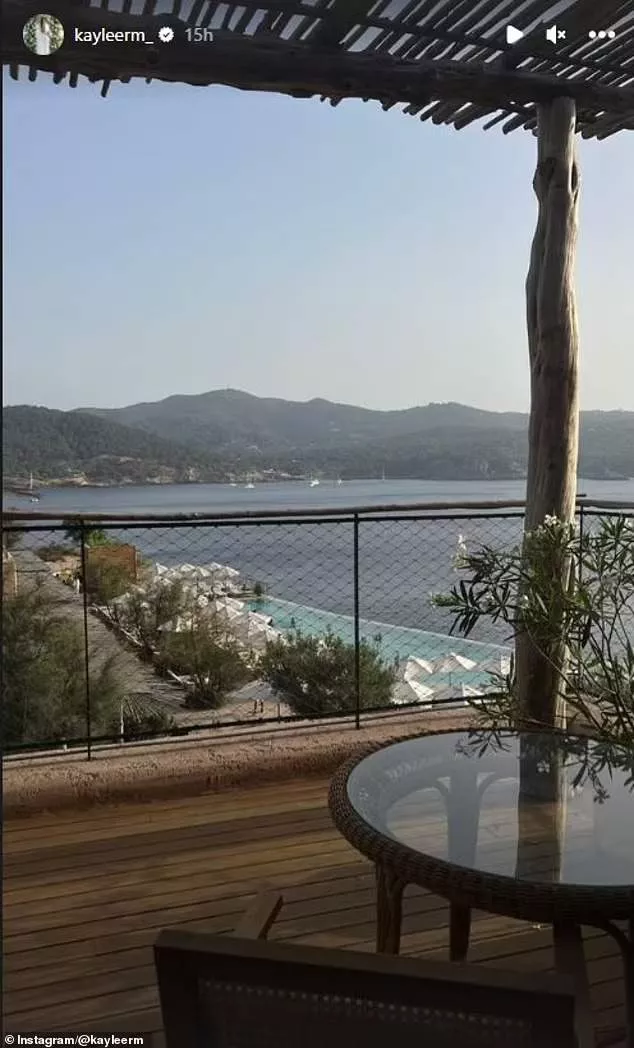Ramman shared a picture of the couple's view, from a terrace overlooking an idyllic bay
