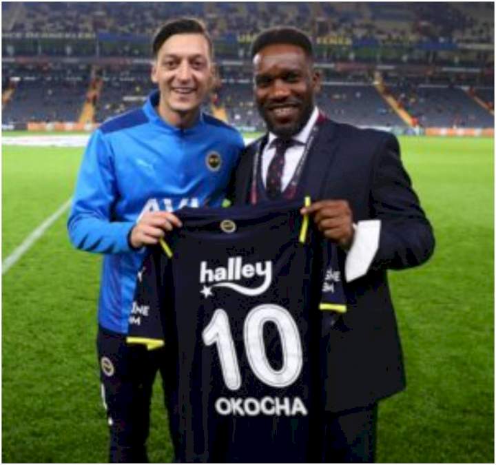 Ozil presents Okocha with favourite no 10 shirt