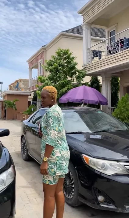 Skit-maker, Ashmusy gifts cars to her loyal workers (Video)