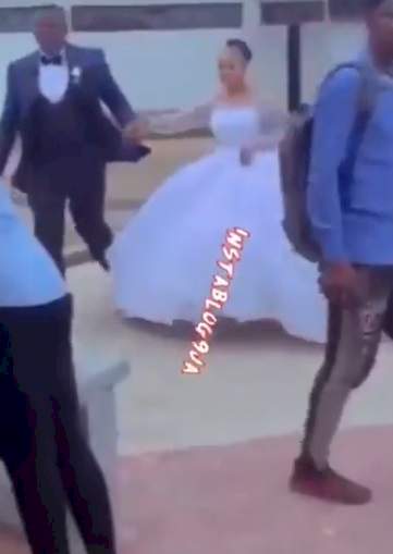 University of Abuja student makes grand entrance into exam hall in wedding dress (Video)